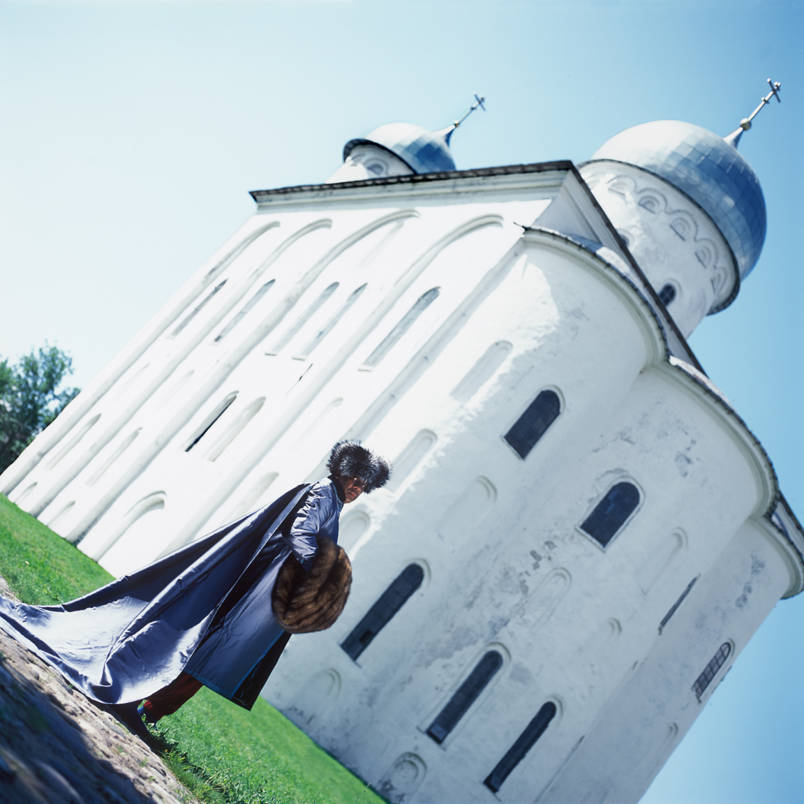 Andre Leon Talley, Vogue magazine's editor at large on his visit to Russia. This picture was taken in front of Georgiev Cathedral, Uriev Monastery, Novgorod Region. Andre Leon Talley's outfit consists of a fur hat by Prada, muff by Fendi and a gown by Chanel Haute Couture.