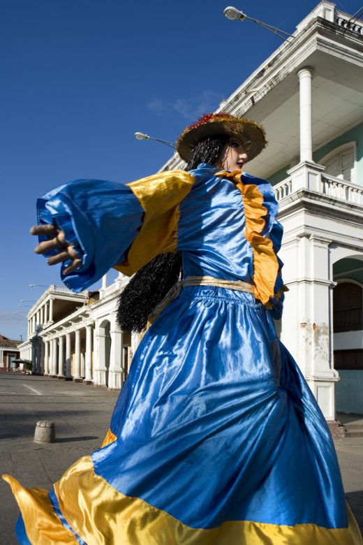Man-driven giant doll, known locally as Gigantone dances on the streets of Granada, Nicaragua.